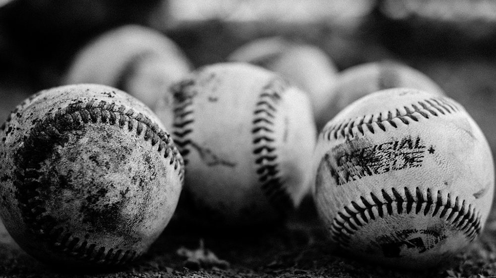 black and white close-up of baseballs