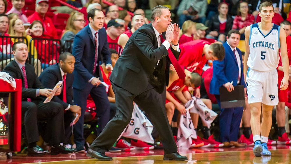 Coach Dan Earl giving instructions from the sidelines.