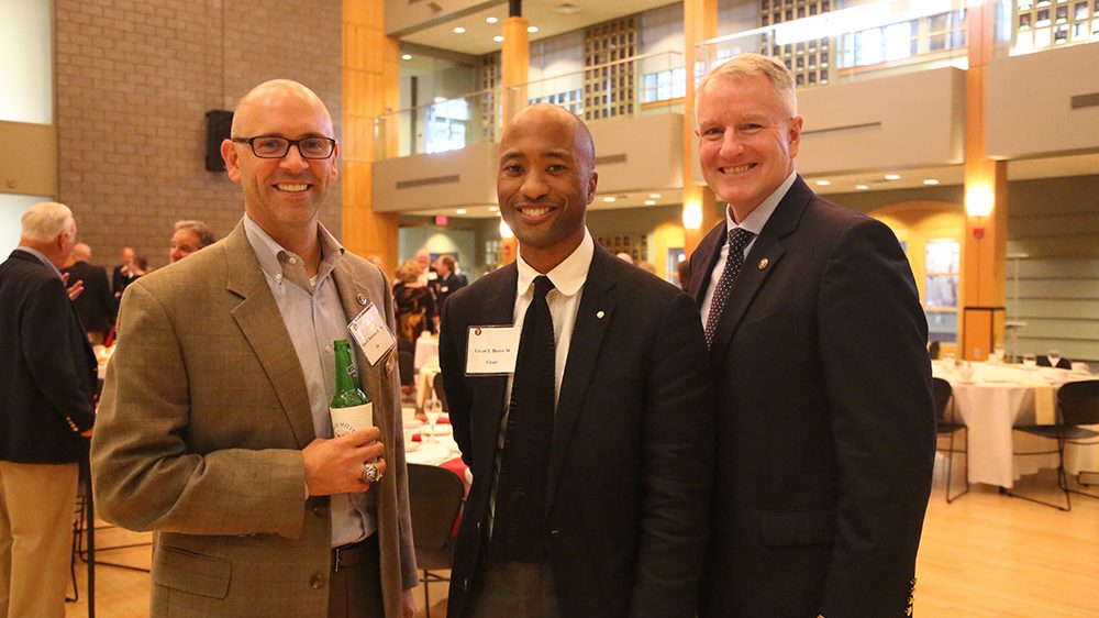 three men smiling