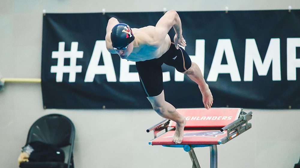 swimmer diving into pool