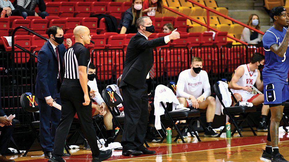 Coach Dan Earl giving instructions from the sidelines.