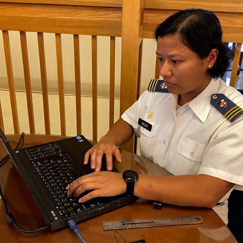 Cadet using laptop for project