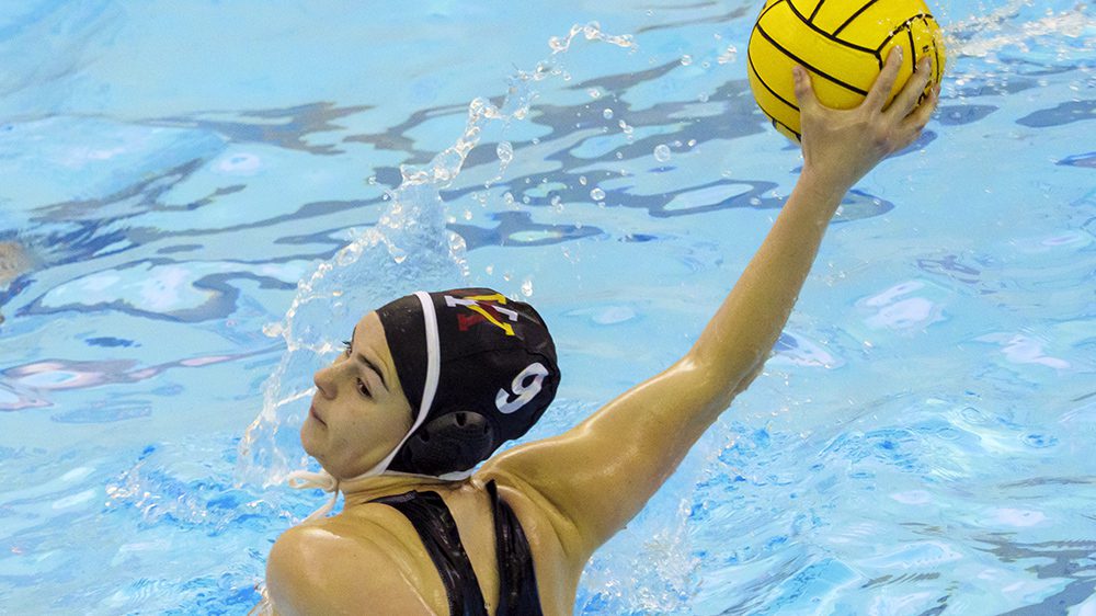 Water polo athlete preparing to throw ball.