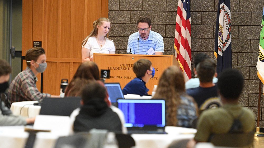 two people behind podium