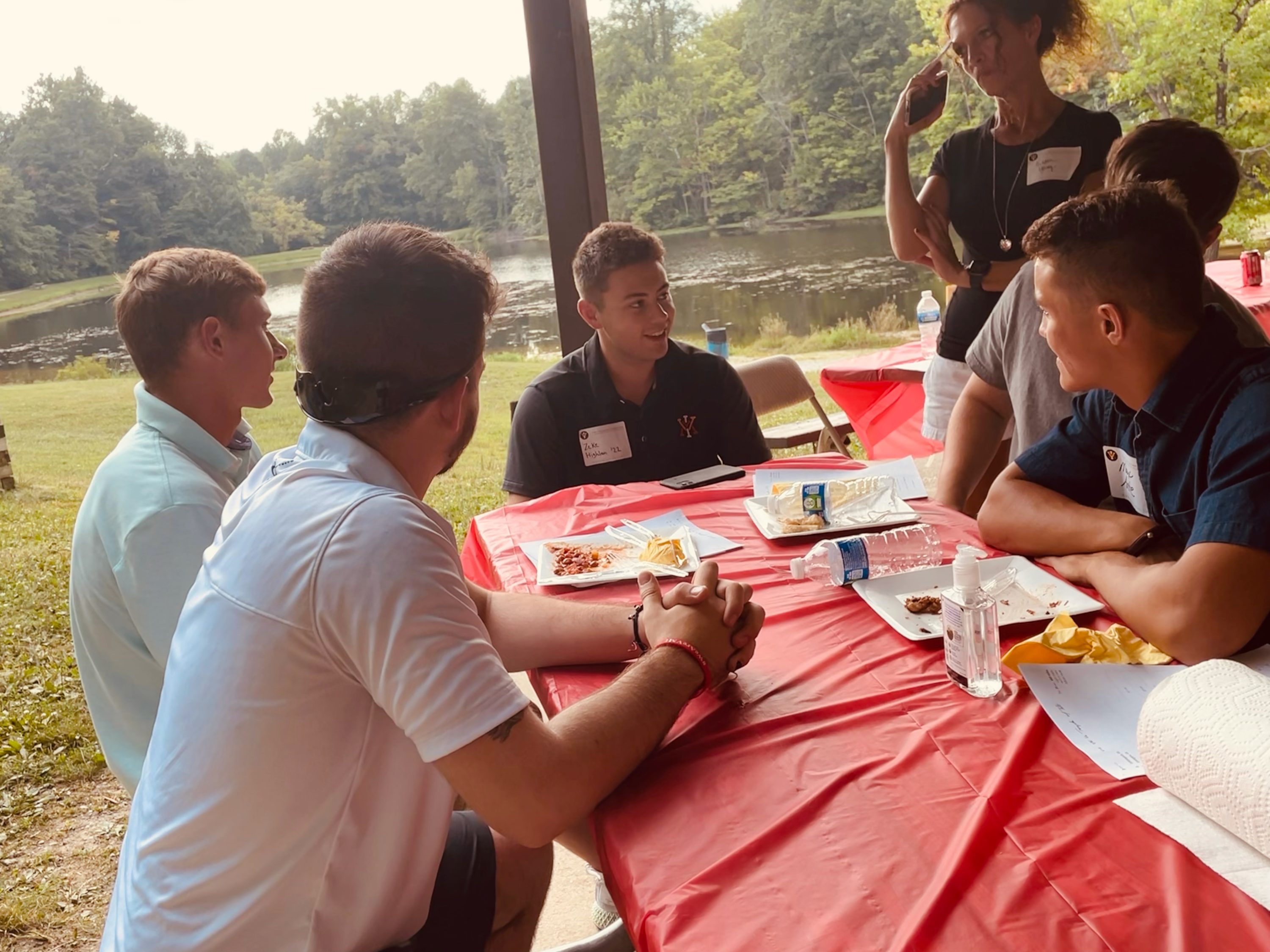 people seated at picnic table