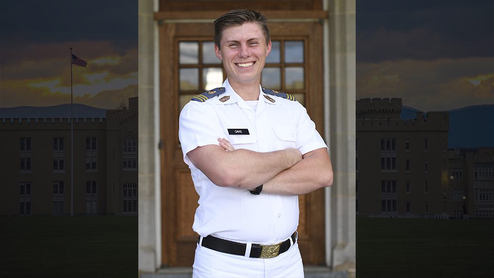 Parker Davis smiling with arms crossed