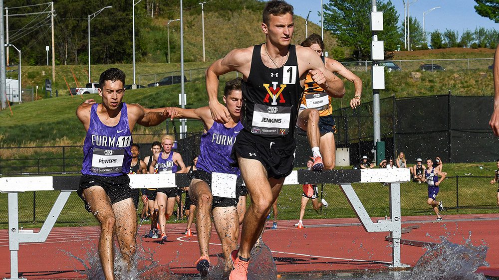 Track athlete running through water.