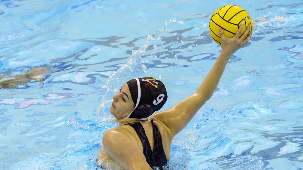 Water polo athlete preparing to throw ball.