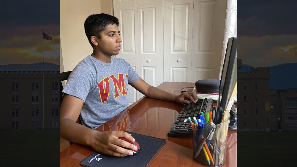 Jacob Benny working on computer