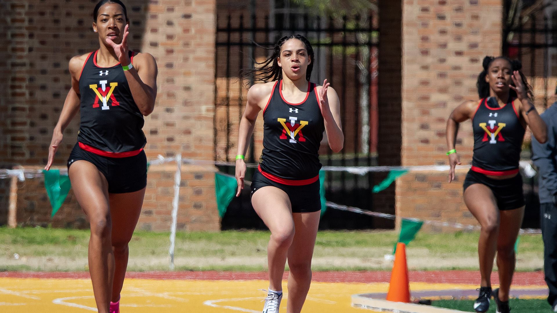 track athletes running outside