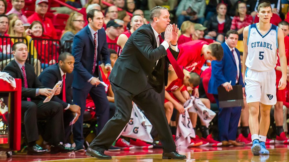 Coach Dan Earl giving instructions from the sidelines.