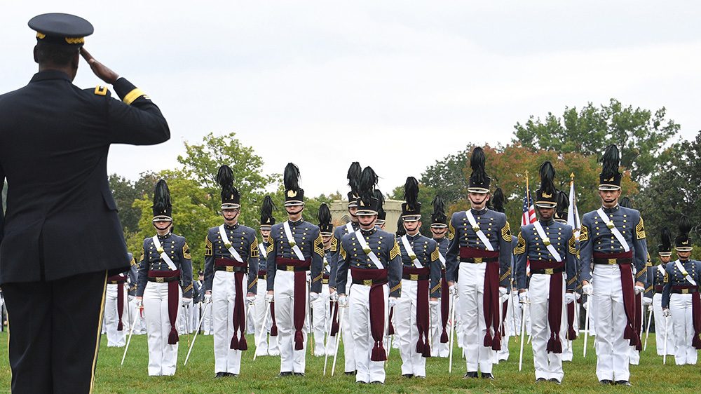 Maj. Gen. Cedric T. Wins '85 salutes regimental staff during parade.