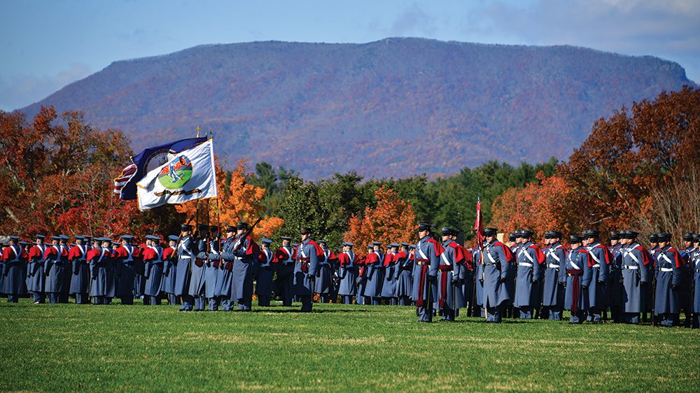 Corps of Cadets in formation on parade ground.