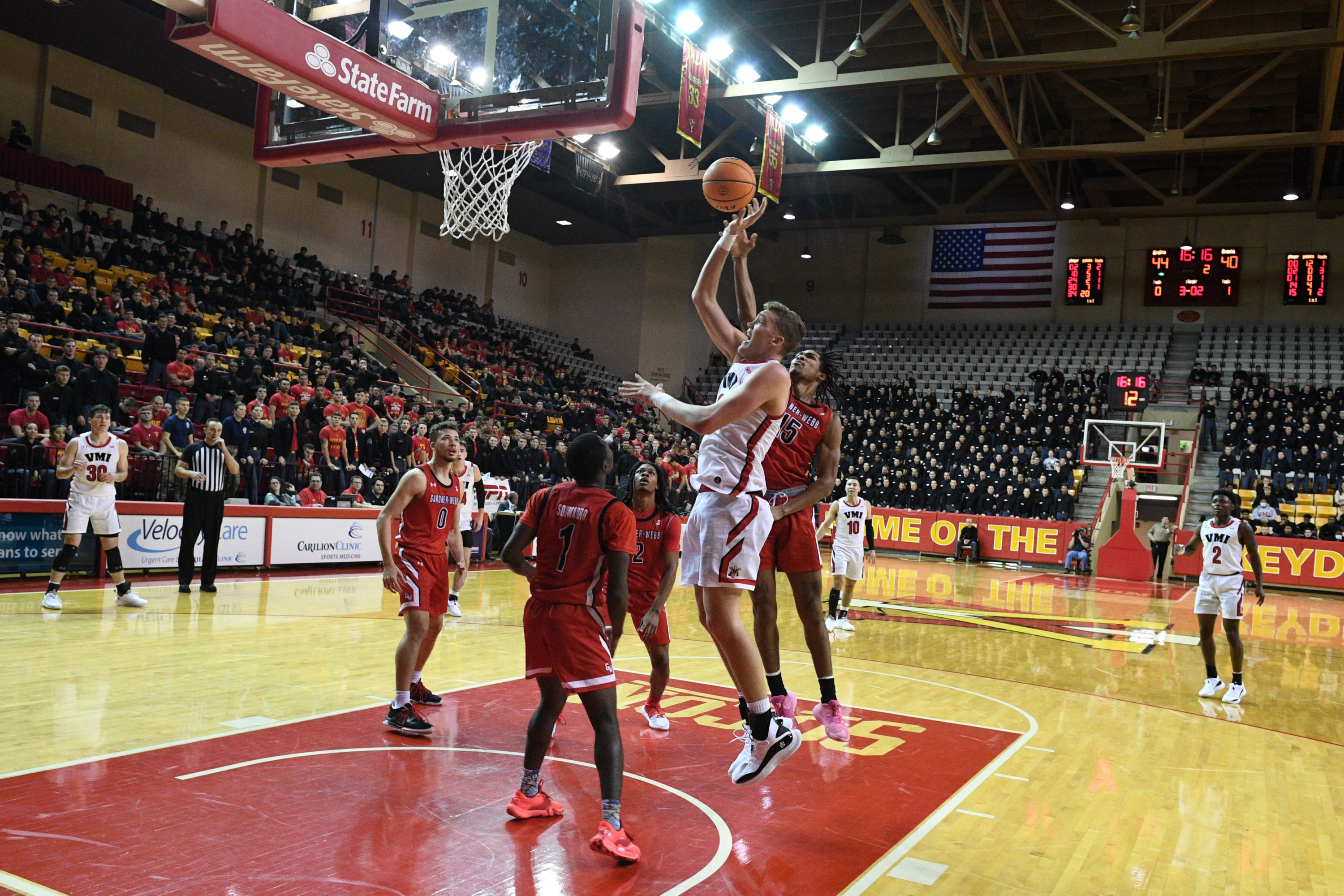 Basketball player shooting a basket.