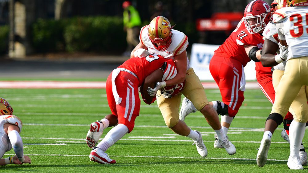 football players mid-tackle