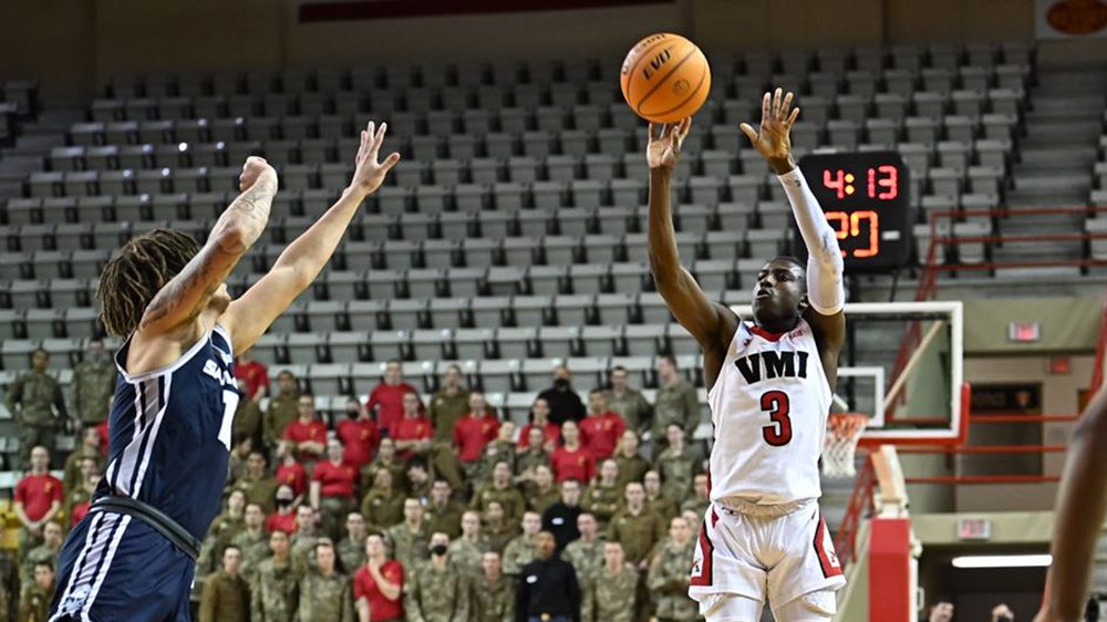 Basketball player shooting a basket.