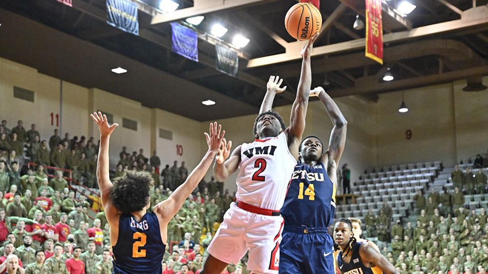 VMI basketball player shooting a basket