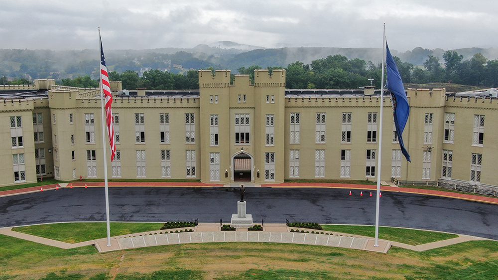 wide shot of new barracks with flag poles on either side, and statue of Gen. George C. Marshall in the center.