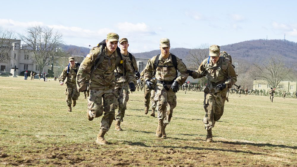 Cadets in OCP running across Parade Ground