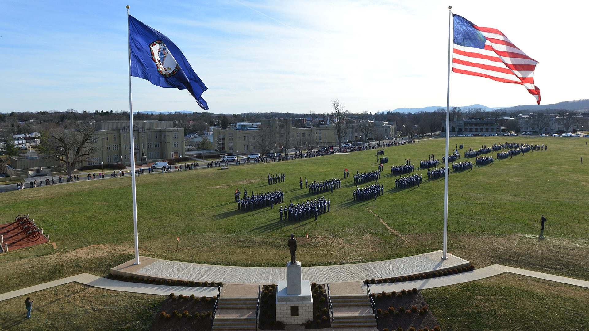 flags on Parade Ground from behind Marshall statue, cadets on Parade Ground