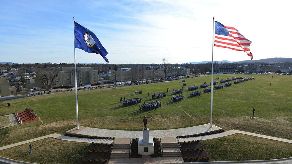flagpoles from behind Marshall statue, cadets lined up on Parade Ground