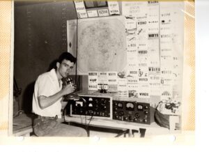John Payne ’58 as a teenager using the ham radio equipment he built himself.
