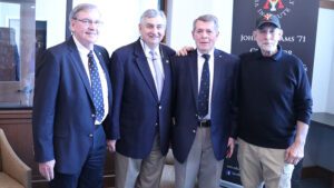 Jim Gearhart ’71, Warren “Buddy” Bryan ’71, Jim Kelly ’71, and John Metzger ’71 pose together in the John A. Adams ’71 Center for Military History and Strategic Analysis.