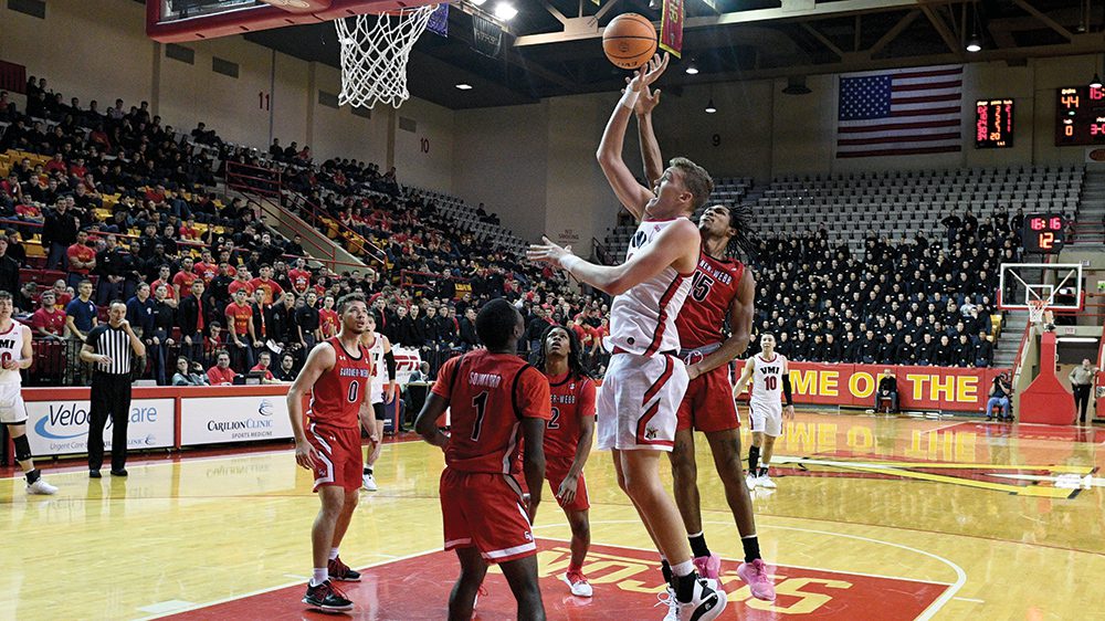 Basketball player shooting a basket.