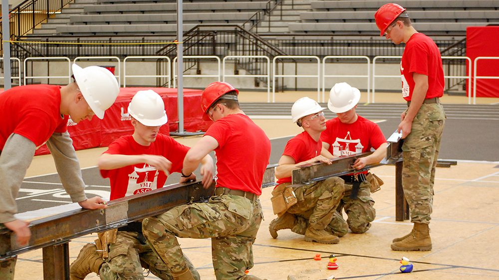 VMI cadets work to assemble their steel bridge during the American Institute of Steel Construction student competition.
