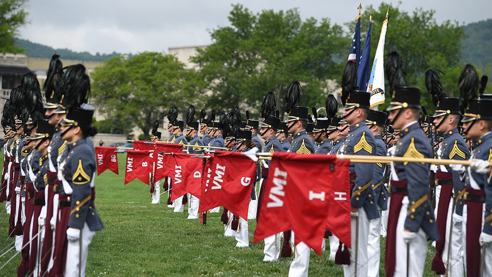 Corps of Cadets in formation on parade ground.