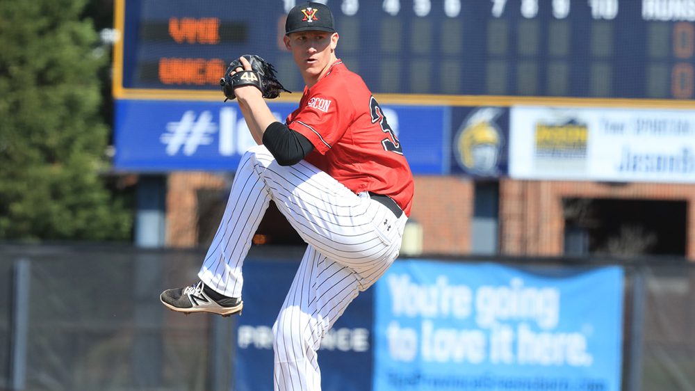 Josh Winder preparing to pitch a baseball.