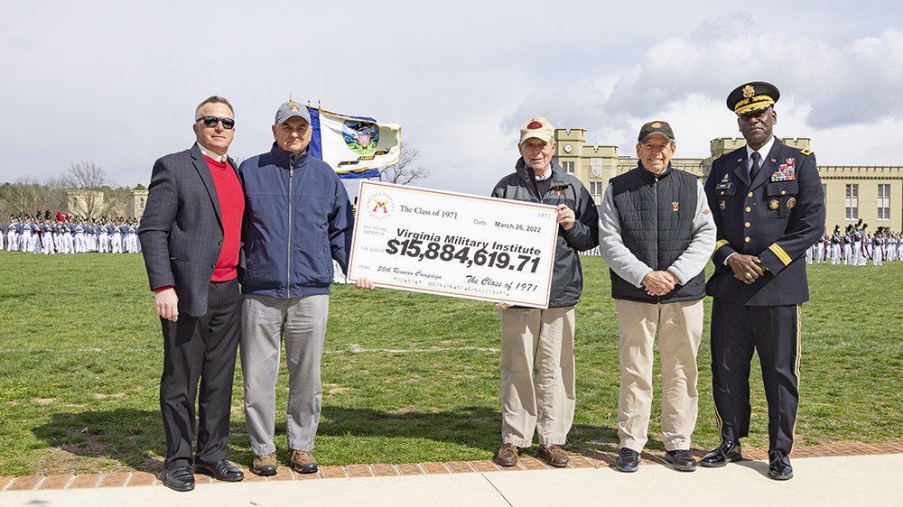 Members of the Class of 1971 pose with David Prasnicki, VMI Alumni Agencies chief executive officer, and Maj. Gen. Cedric Wins '85, superintendent, to present a check to the Institute.