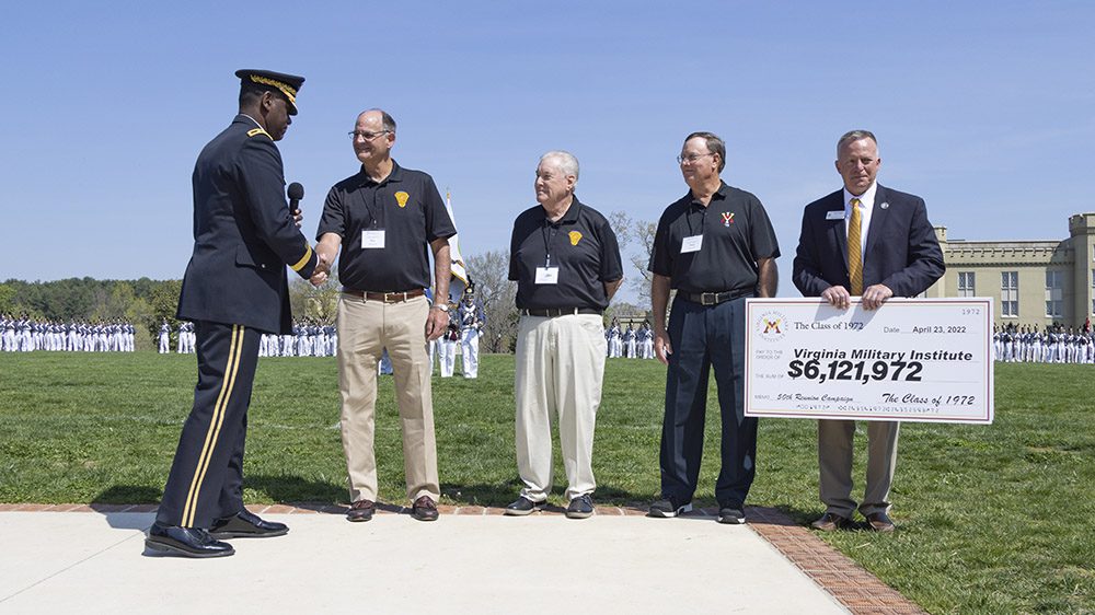 Members of the Class of 1972 pose with David Prasnicki, VMI Alumni Agencies chief executive officer, and Maj. Gen. Cedric Wins '85, superintendent, to present a check to the Institute.