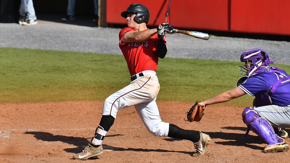 baseball player swinging baseball bat