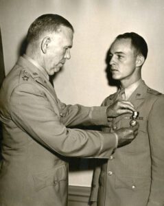 Gen. George C. Marshall, Class of 1901 pinning a medal on Frank McCarthy, Class of 1933.