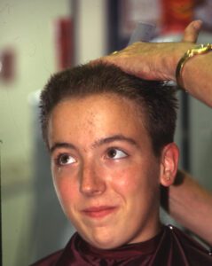 Female rat getting head shaved