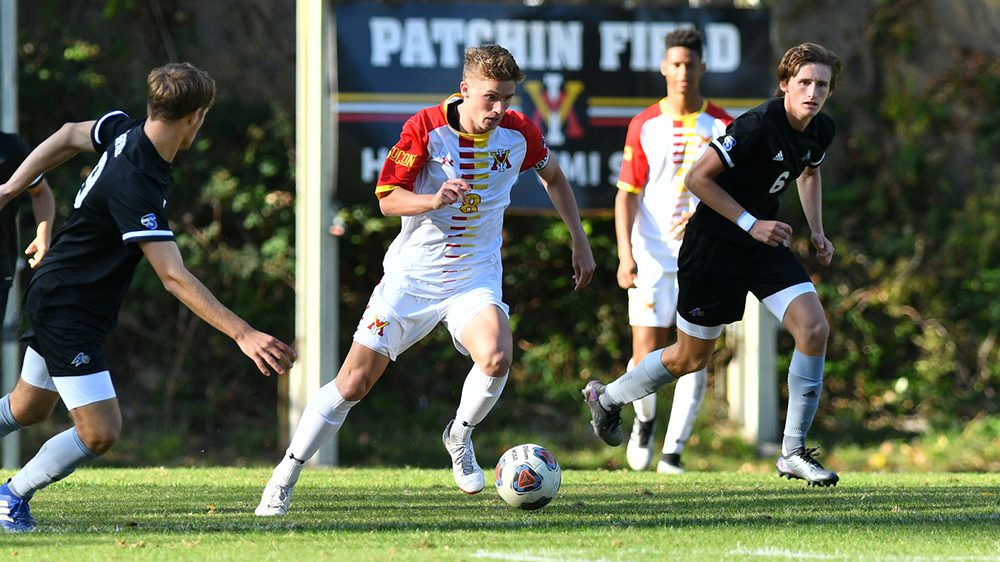 soccer player kicking a ball