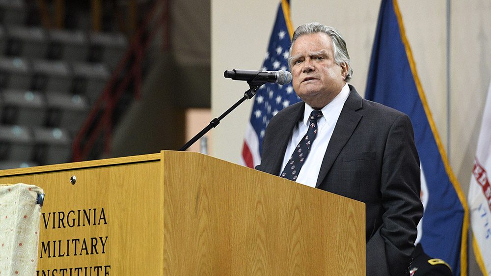 John Duke Anthony III '62 addressing the Corps of Cadets in Cameron Hall.