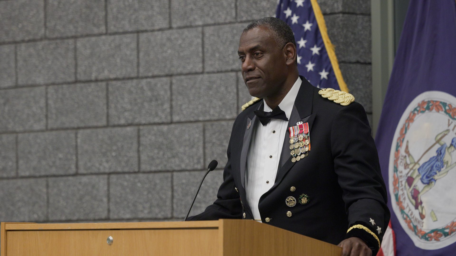 Maj. Gen. Wins speaking at podium.