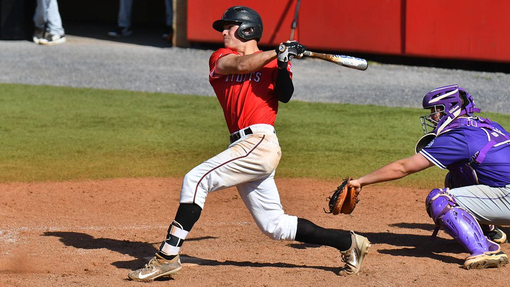 baseball player swinging bat