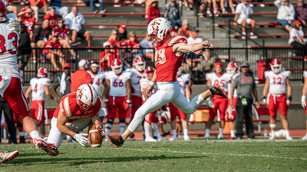 kicker punting a football