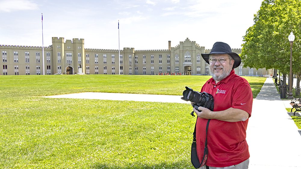 Charles “Chuck” Steenburgh ’86 holding camera