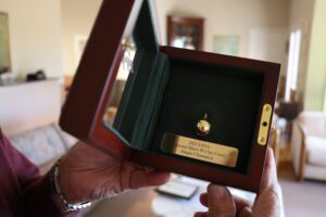 Billy Kingery ’54 shows the gold ball he was given for winning first place in his age group at the USTA National Clay Court Championship.