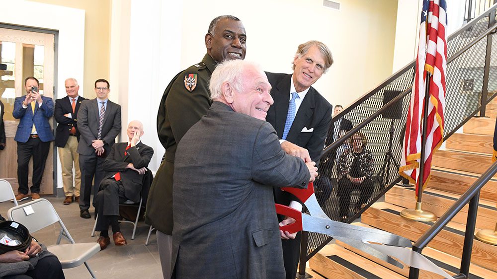 Maj. Gen. Cedric Wins '85, Tom Zarges '70, and Tom Watjen '76 cutting ribbon at the dedication ceremony of the new VMI Aquatic Center.