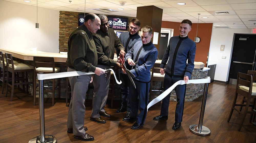 Col. Adrian T. Bogart III ’81, Maj. Gen. Cedric T. Wins ’85, along with Cadets Cameron Cavanaugh ’23, Blake Smith ’23, and Garrett Petruskie ’23, make the ceremonial ribbon cut together at The Arsenal, the new cadet activity center.