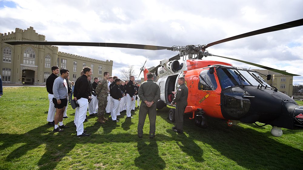 cadets gathered around helicopter on parade ground