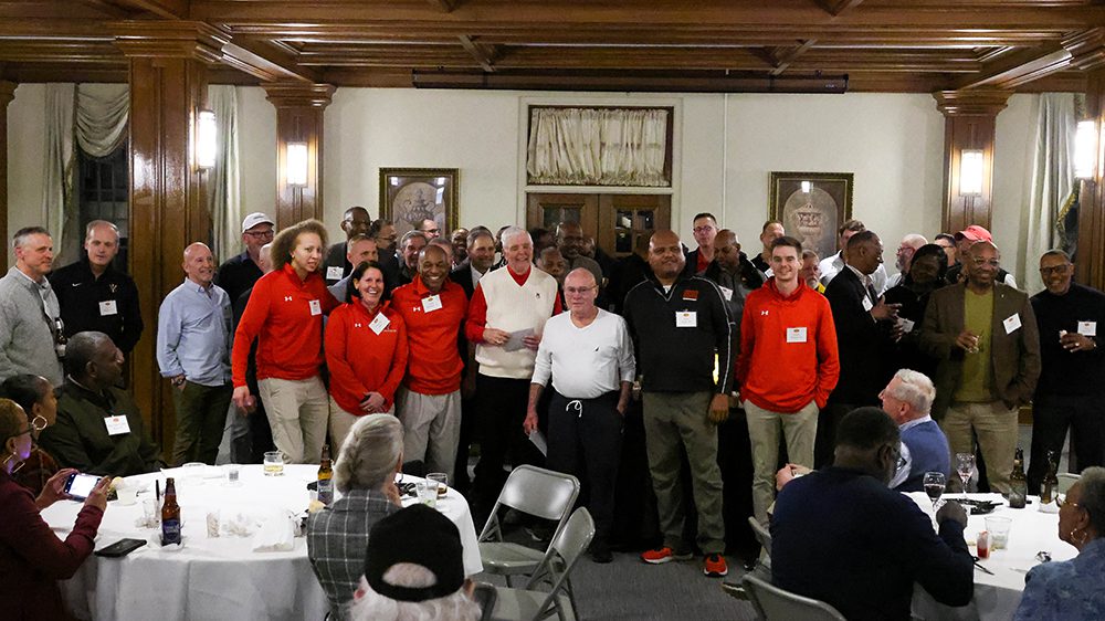 Former VMI track athletes and coaches gather for a photo