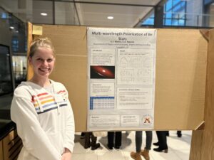 Woman posing with presentation poster