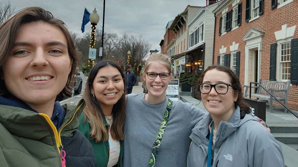 four women posing for a selfie