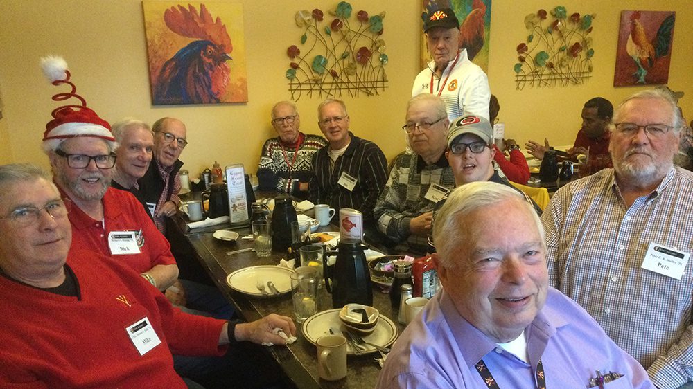 alumni sitting around a table